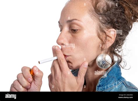 Beautiful young woman lighting cigarette hi-res stock photography and ...