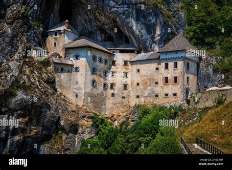 The Predjama Castle in Slovenia. Legendary cave castle in a cliff with network of secret tunnels ...