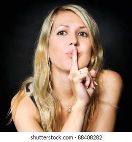 Portrait Blonde Woman Finger On Lips Stock Photo Shutterstock