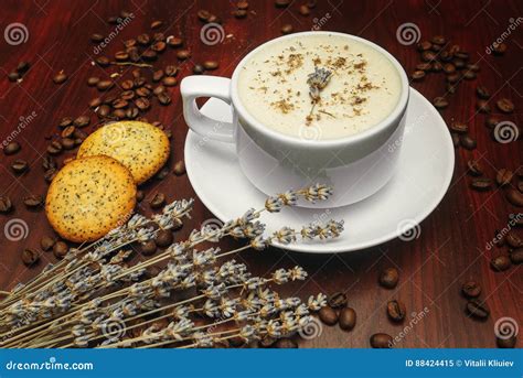 Cup Of Coffee With Milk Pussy Willow And Dried Branches And Leaves At Brown Background Stock
