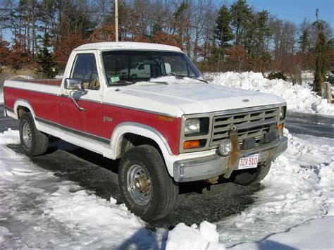 Two Tone Red White Lifted Ford Truck In The Winnipeg Snow Chevy Trucks