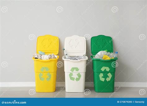 Containers with Different Types of Garbage Near Light Wall. Recycling ...