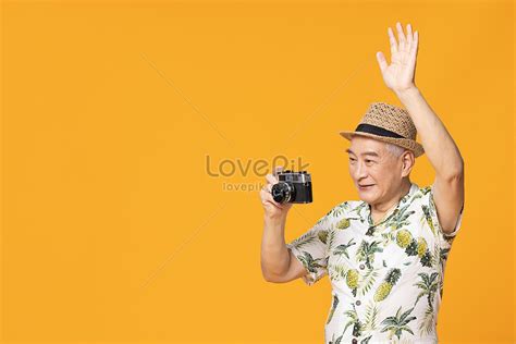 The Old Man Taking A Camera Around The Camera Picture And Hd Photos