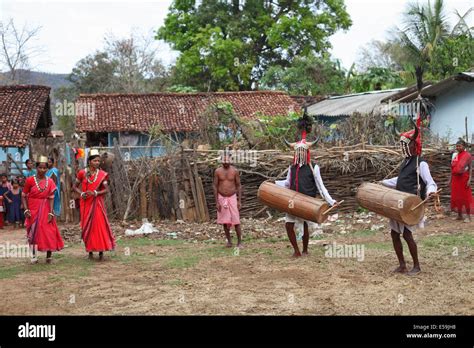 Tribal People Performing A Typical Tribal Dance In Traditional Outfits