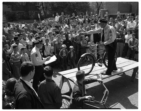 Ann Arbor Police Department Officers Displays Bike At Auction May 1954