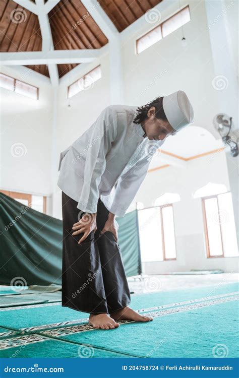 Muslim Man Doing Sujud Or Sajdah On The Glass Floor Royalty Free Stock