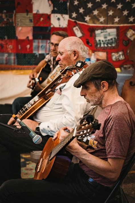 Photo of Men Playing Acoustic Guitar · Free Stock Photo