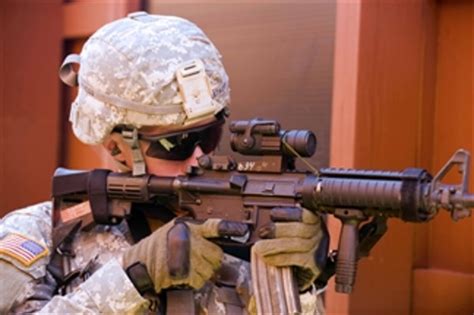 Spc Christopher Hakathorn Provides Security From A Doorway Of The