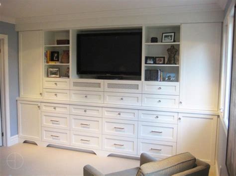 High in middle and a lot of drawers - consider drawers on bottom with cabinet on top at ends ...