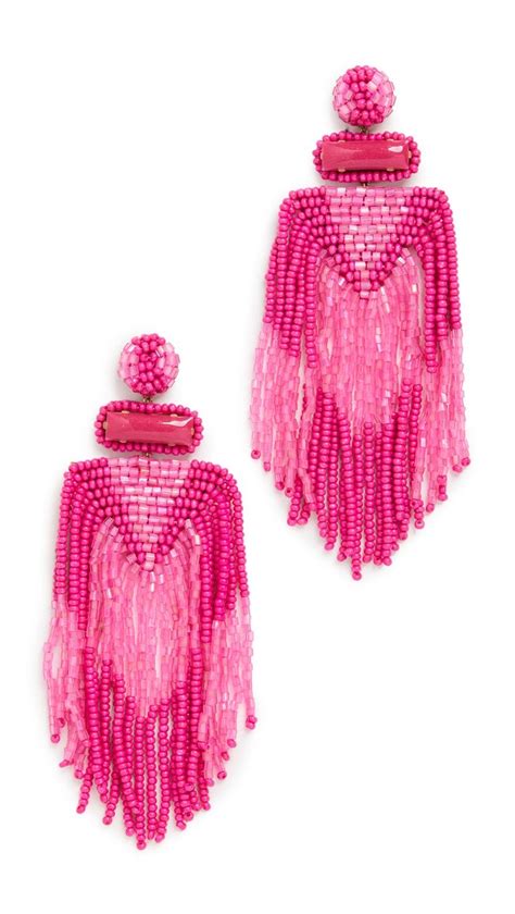 Pair Of Pink Beaded Earrings With Heart And Tassels On White Background