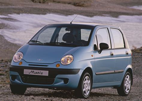 Download Sleek Daewoo Matiz Gliding On Glossy Streets Wallpaper