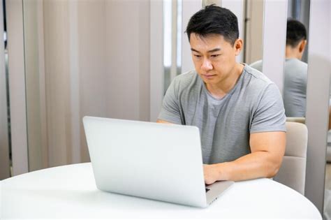 Premium Photo Of A Nice Smiling Man Working On A Project At Home