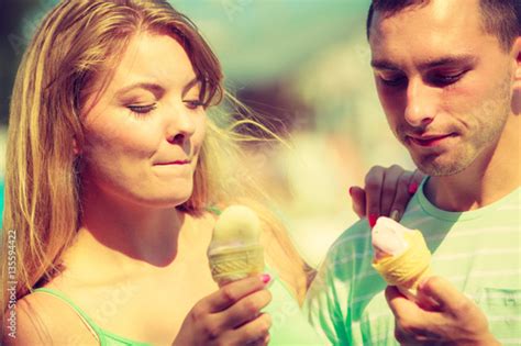 Man And Woman Eating Ice Cream On Beach Stock Photo Adobe Stock