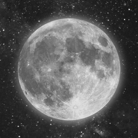 The Full Moon Is Shown In Black And White