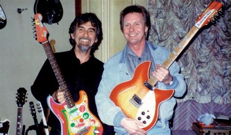 George Harrison Holding His Guitar Named Rocky From The Book Concert For George George