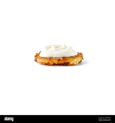 Sour cream on top of mini rosti Stock Photo - Alamy