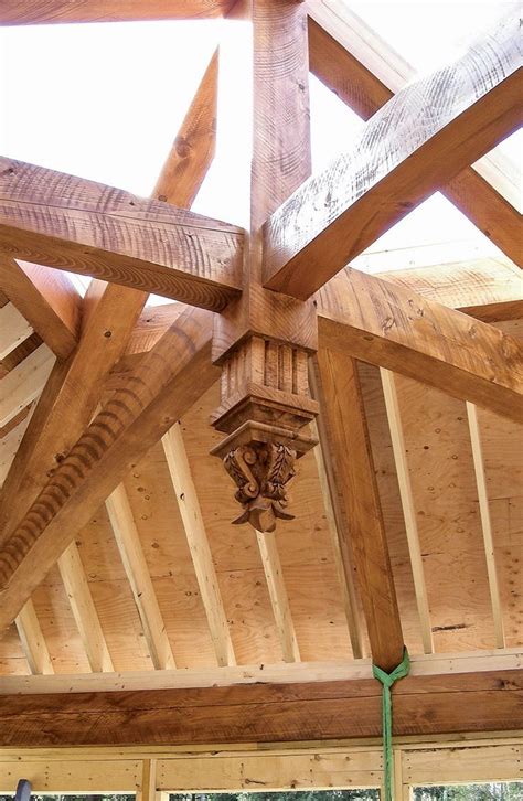 The Inside Of A Building With Wooden Beams