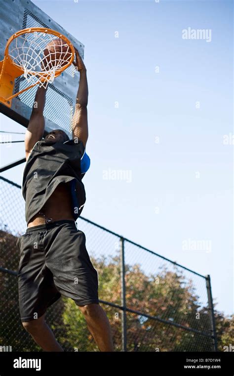 A Basketball Player Making A Slam Dunk Stock Photo Alamy