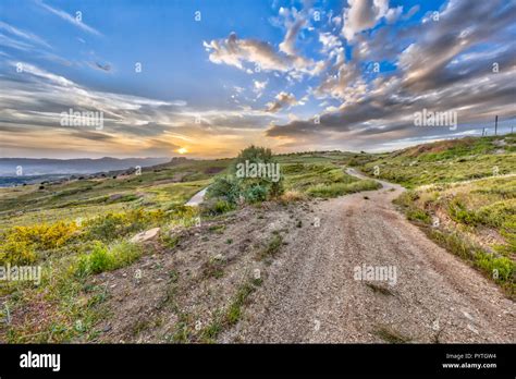 Road through Mediterranean landscape on the island of Cyprus with hot ...