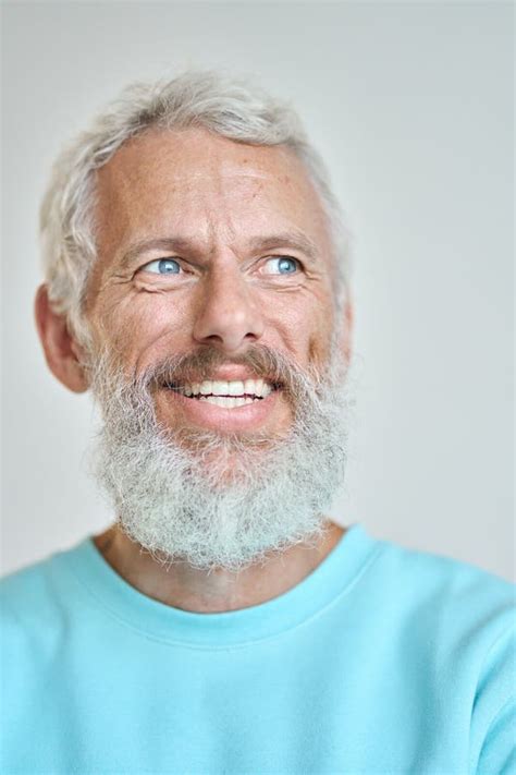 Smiling Senior Old Man Looking Away Dreaming Isolated On White