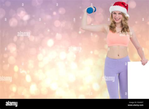 Composite Image Of Festive Fit Blonde Smiling At Camera Holding Poster