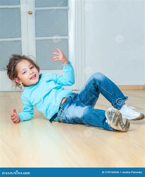 Little Girl Lying on the Floor in the Room Stock Photo - Image of ...