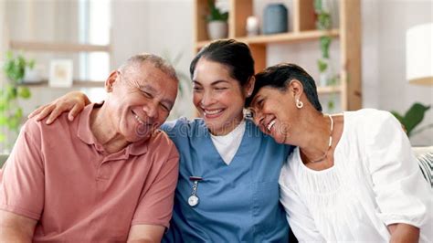 Happy Senior And Couple Hug With Nurse On Sofa For Healthcare Support