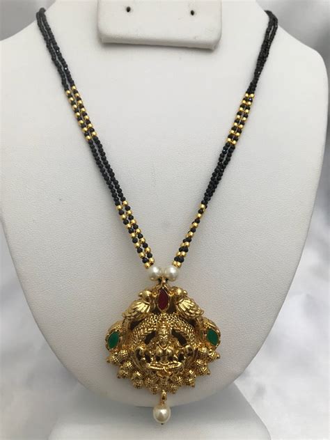 Beautiful And Traditional Look Lakshmi Print Pendant With Black Beads