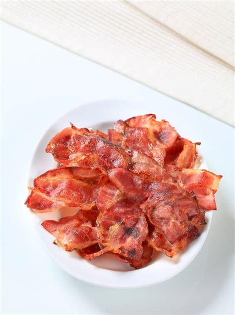 Crispy bacon strips stock photo. Image of closeup, white - 25783908