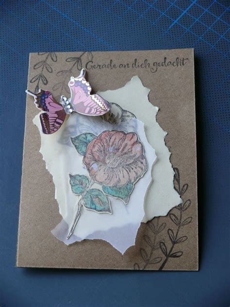 A Piece Of Paper With Flowers On It And A Butterfly Sitting On Top Of It