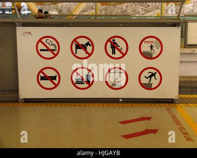 Prohibition signs and symbols in a subway station Stock Photo - Alamy