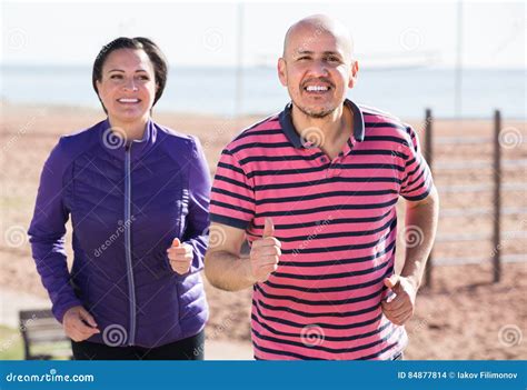 Mature Couple Jogging Together Stock Photo Image Of Action Activity