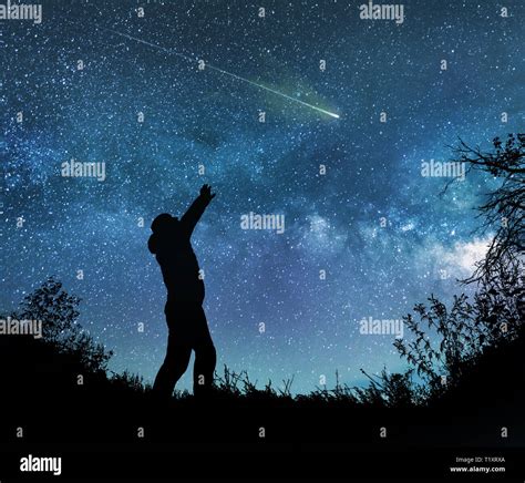 man watching the stars in night sky Stock Photo - Alamy