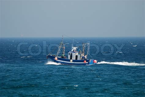 Fishing boat in the ocean | Stock image | Colourbox