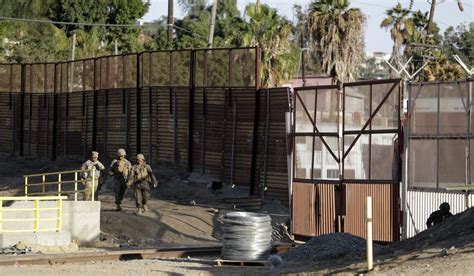 U.S. 'hardening' Tijuana border crossing ahead of migrant caravan ...