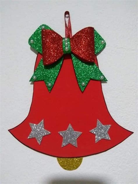 A Red And Green Christmas Bell Ornament With Stars On It S Side