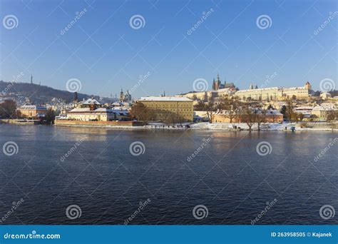 Snowy Prague Lesser Town with Prague Castle Above River Vltava in the ...