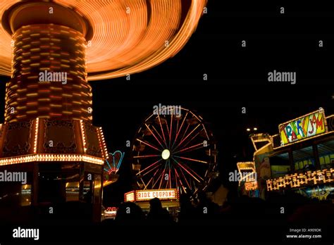 Carnival rides at night Stock Photo - Alamy