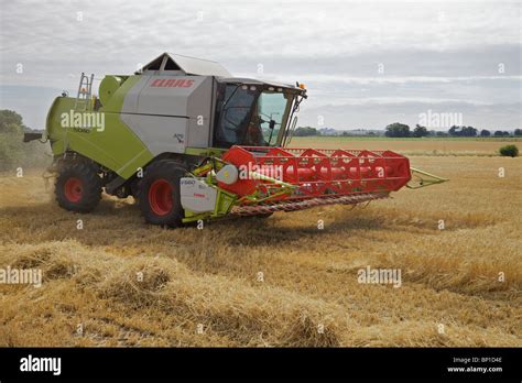 A Claas Combine Harvester Working In England Stock Photo Alamy