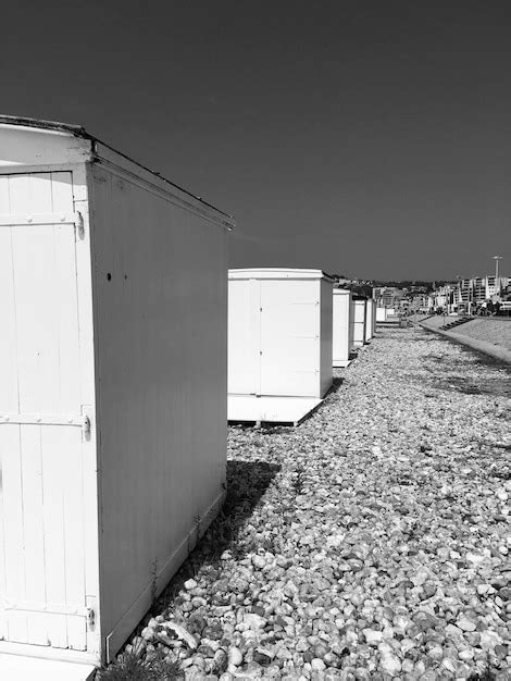 Premium Photo Empty Footpath By Building Against Clear Sky