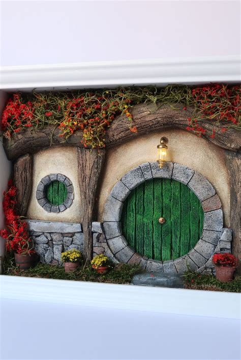 A Green Round Door Yellow And Red Plants And A Stone Wall Hobbit