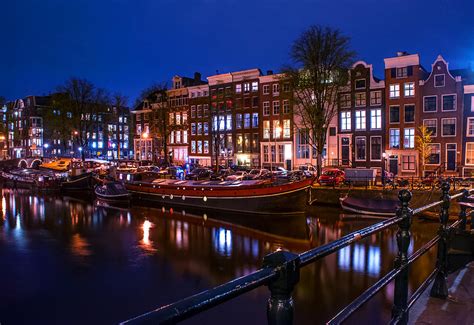 Night Lights on the Amsterdam Canals. Holland Photograph by Jenny Rainbow