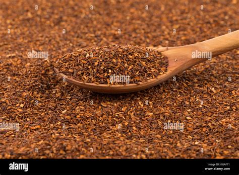 Heap Of Red Dry Rooibos Healthy Traditional Organic Tea In Spoon Stock