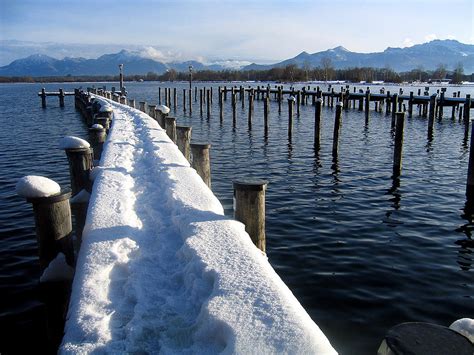 boat harbour at Lake Chiemsee in winter Photograph by Angela Kail | Fine Art America