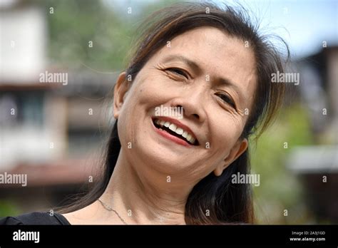 A Smiling Older Filipina Female Senior Stock Photo Alamy