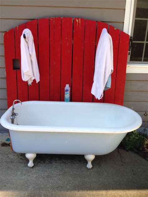 Outdoor Dog Washing Station. Took and old fence, put it behind the tub ...