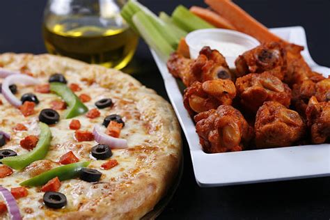 Best Pizza Wings Stock Photos, Pictures & Royalty-Free Images - iStock