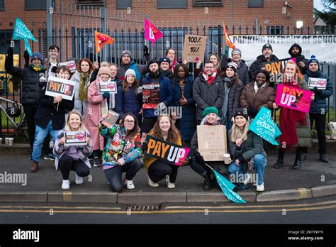 Teachers Take To The Picket Lines With Flags And Placards Expressing