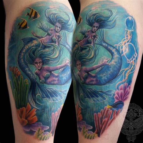 Two Mermaids On Their Legs With Different Colors