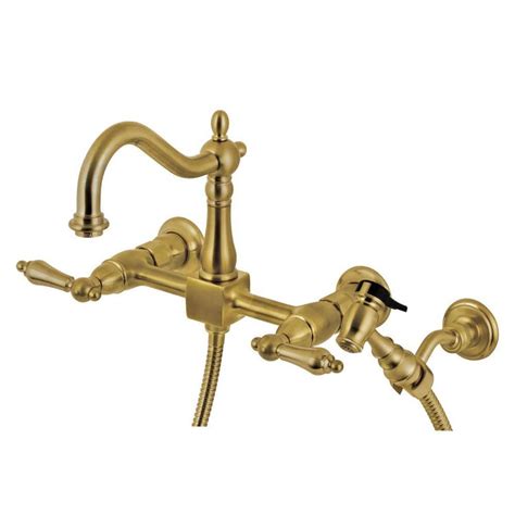 Kingston Brass Heritage 2 Handle Wall Mount Kitchen Faucets With Brass Sprayer In Brushed Brass